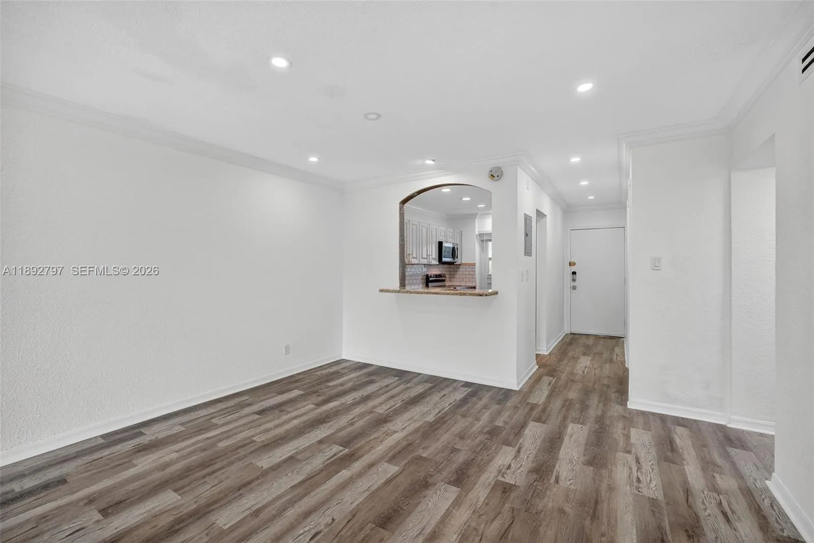 Flat Ceilings with high hat lighting. Updated flooring and paint, Impact Windows