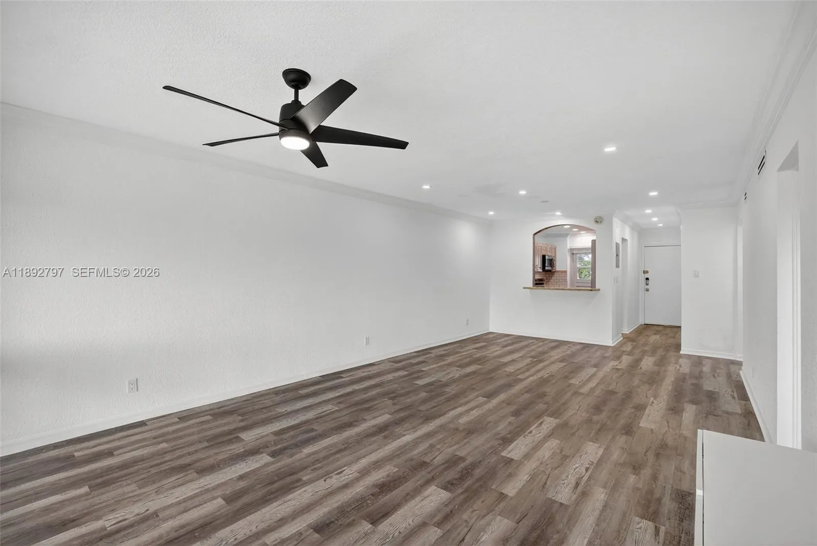 Flat Ceilings with high hat lighting. Updated flooring and paint, Impact Windows