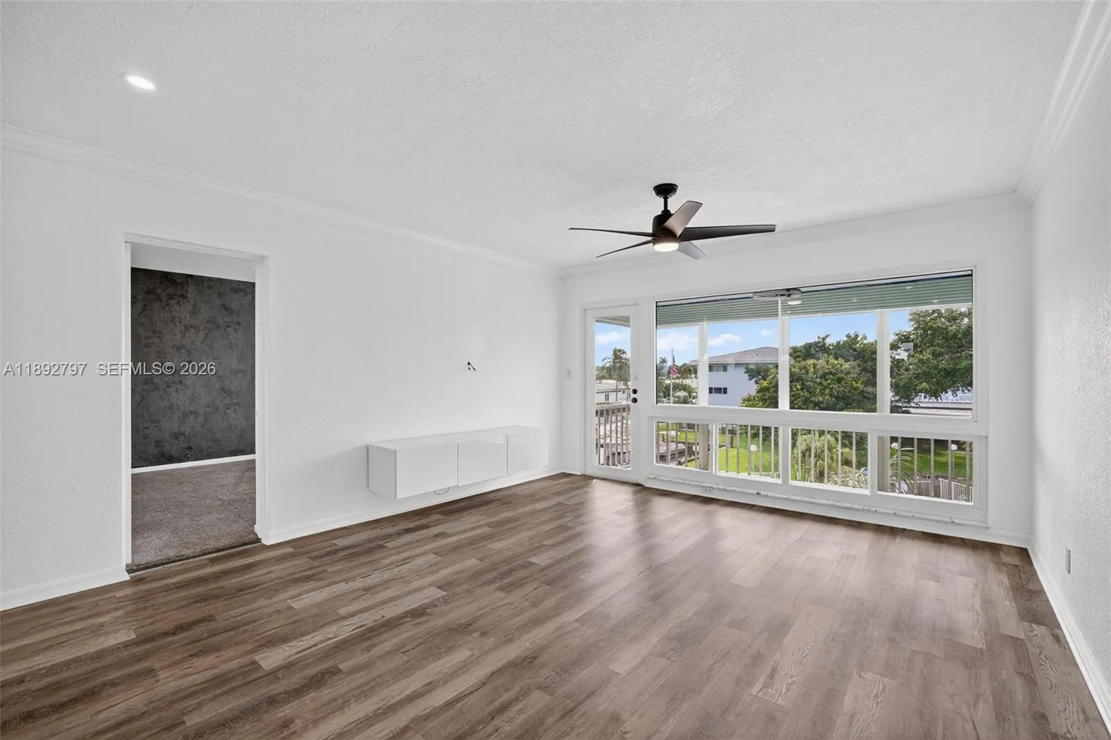 Flat Ceilings with high hat lighting. Garden & Water Views. Updated flooring and paint, Impact Windows