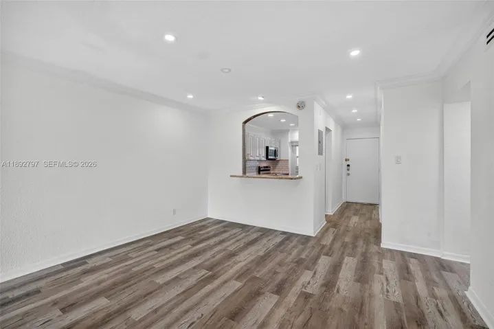 Flat Ceilings with high hat lighting. Updated flooring and paint, Impact Windows