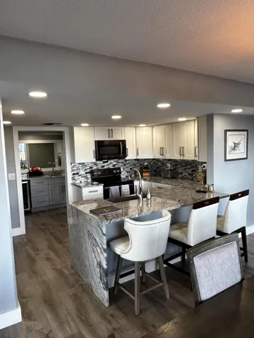 KITCHEN REMODELED WITH WALL REMOVED