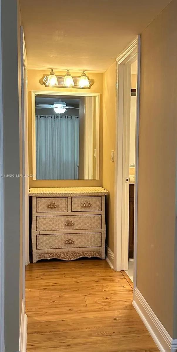 A hall to the master bedroom bathroom and the walk-in closet