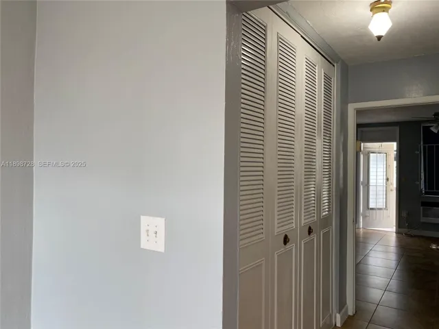 The hallway closet on the left.