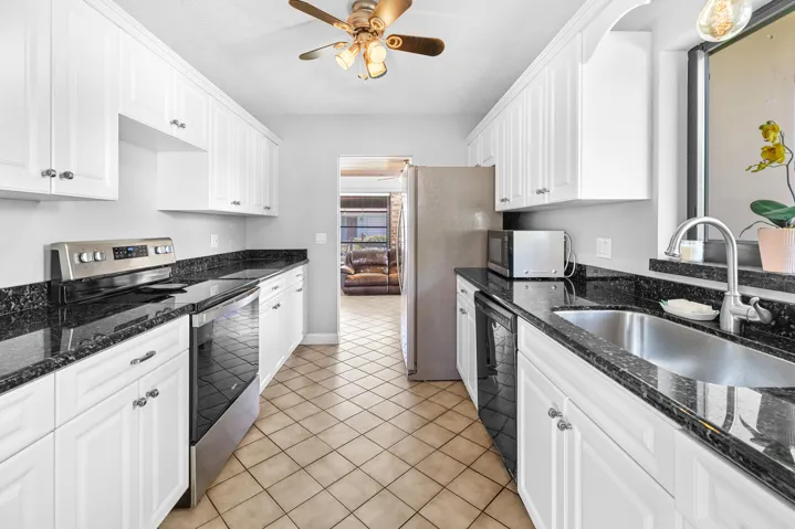 Kitchen step down into extra entertaining room