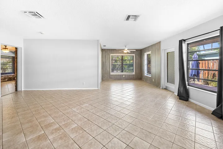 Living -dining area lead to the out door patio that is fenced in and perfect pet friendly area