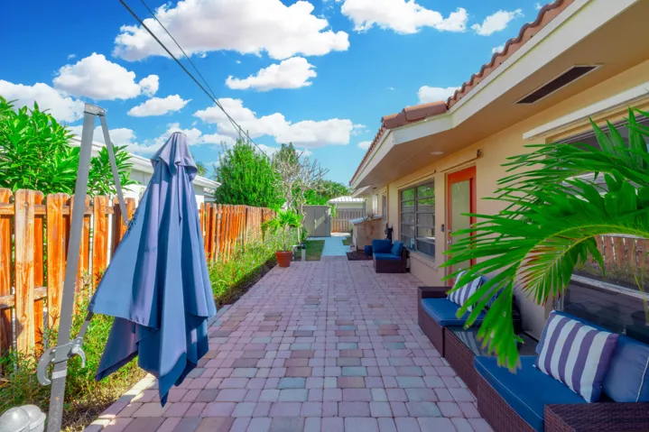 Fenced back yard with paver patio