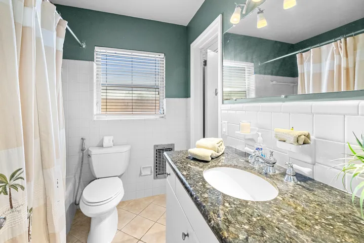 Master bathroom with tub that leads into a large walkthrough master closet and master bedroom
