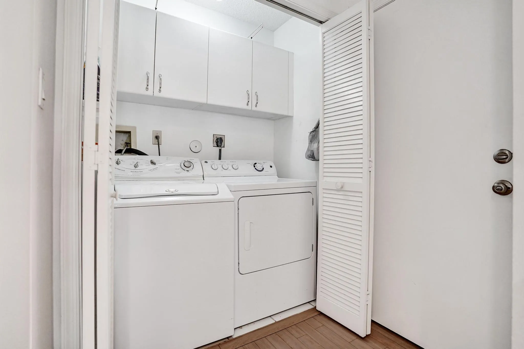 Located in Kitchen off the garage door access. Lighting, Cabinets.