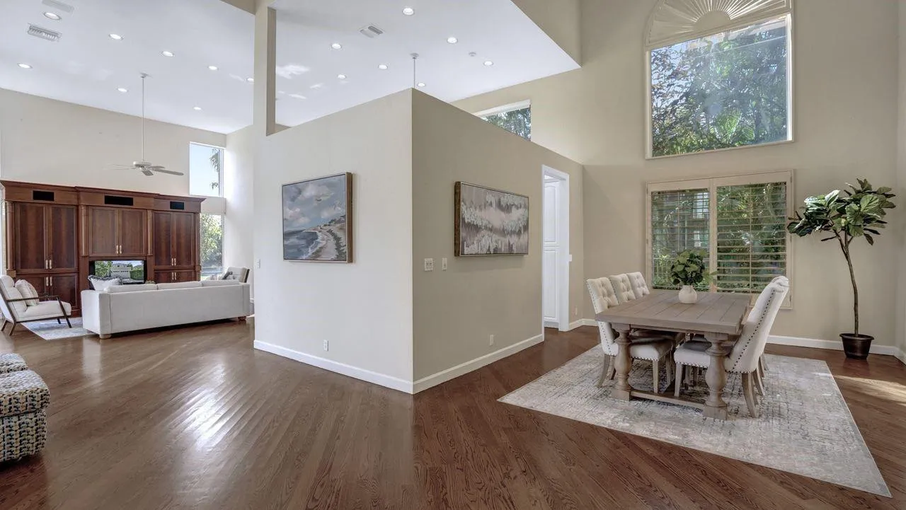 Showing dining room with kitchen behind the wall.