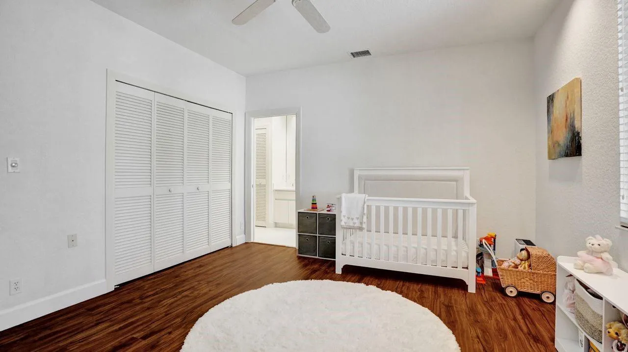 Wood flooring in bedrooms.