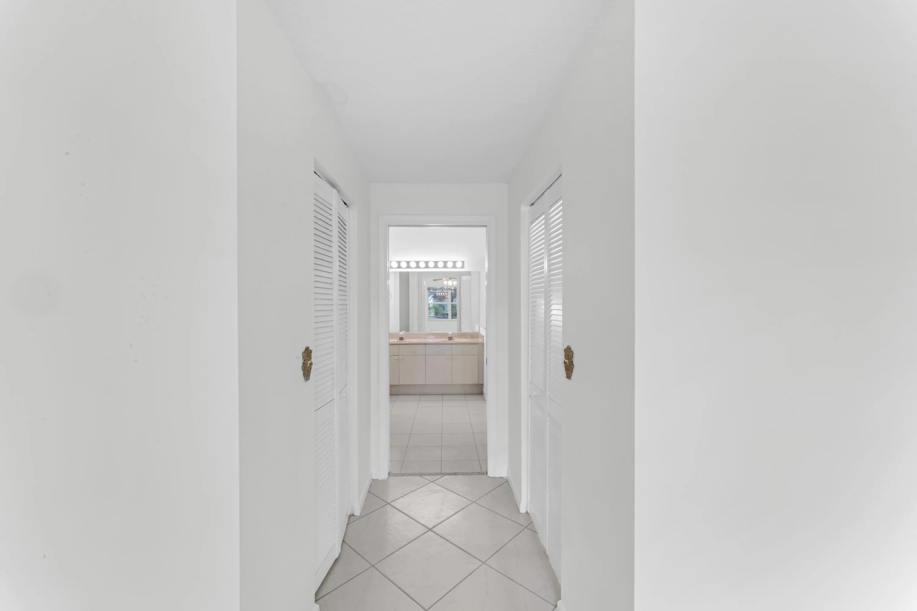 Primary closets from bedroom to bathroom