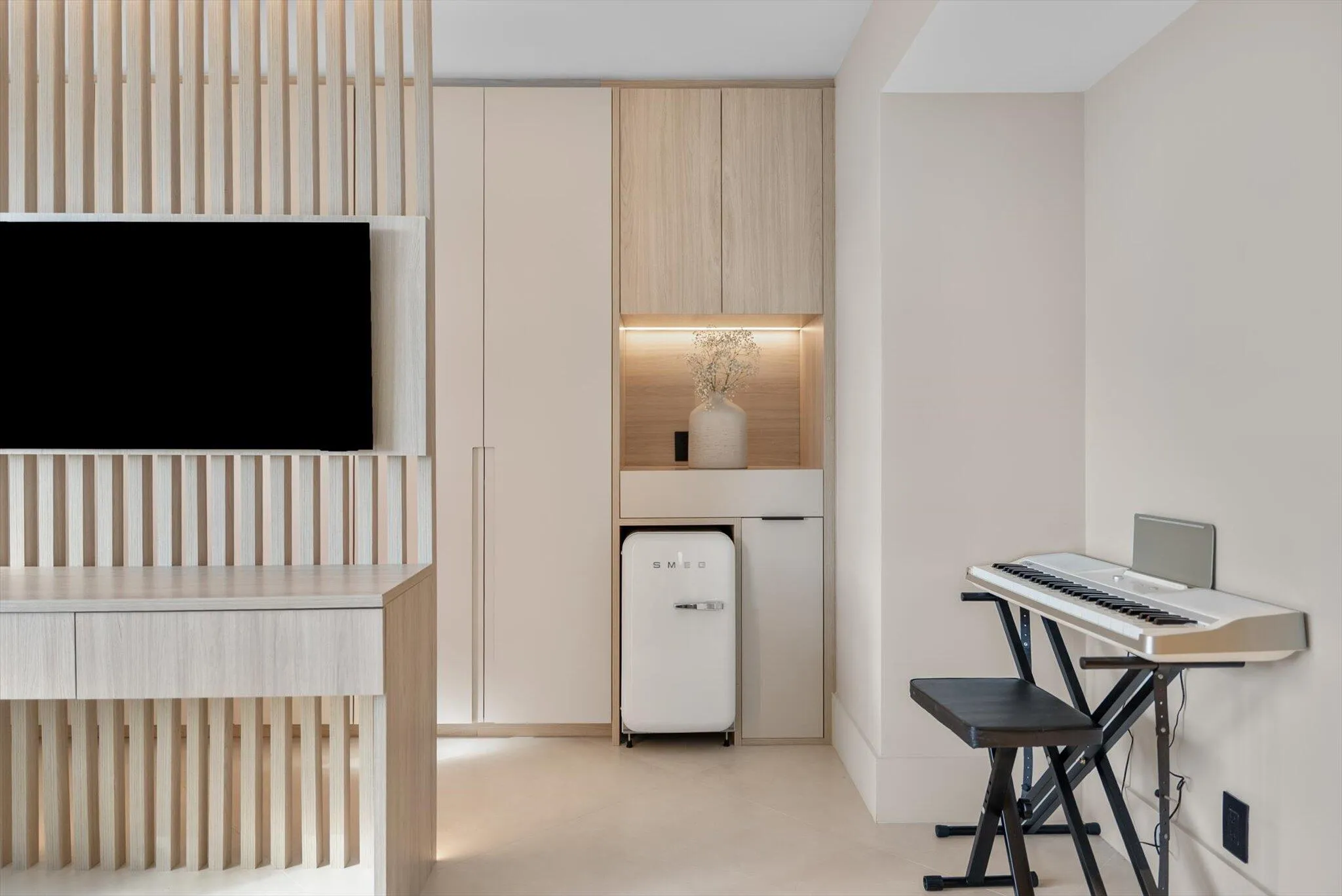 Guest Suite with Beverage Area and Smeg Refigerator and Custom Wood Design Desk