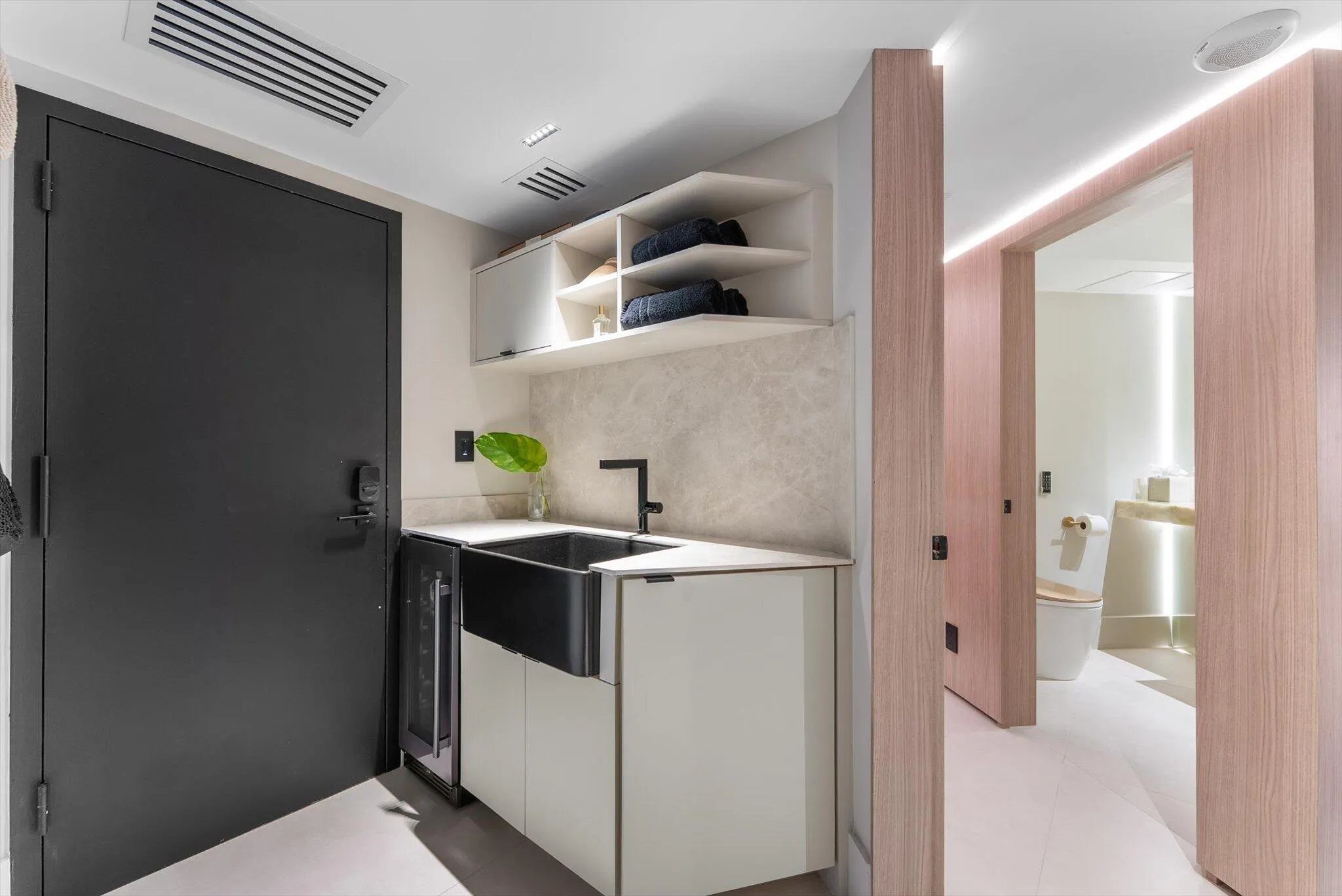Pet/Beach Area/Storage Room with XO Beverage Refrigerator, and Sink
