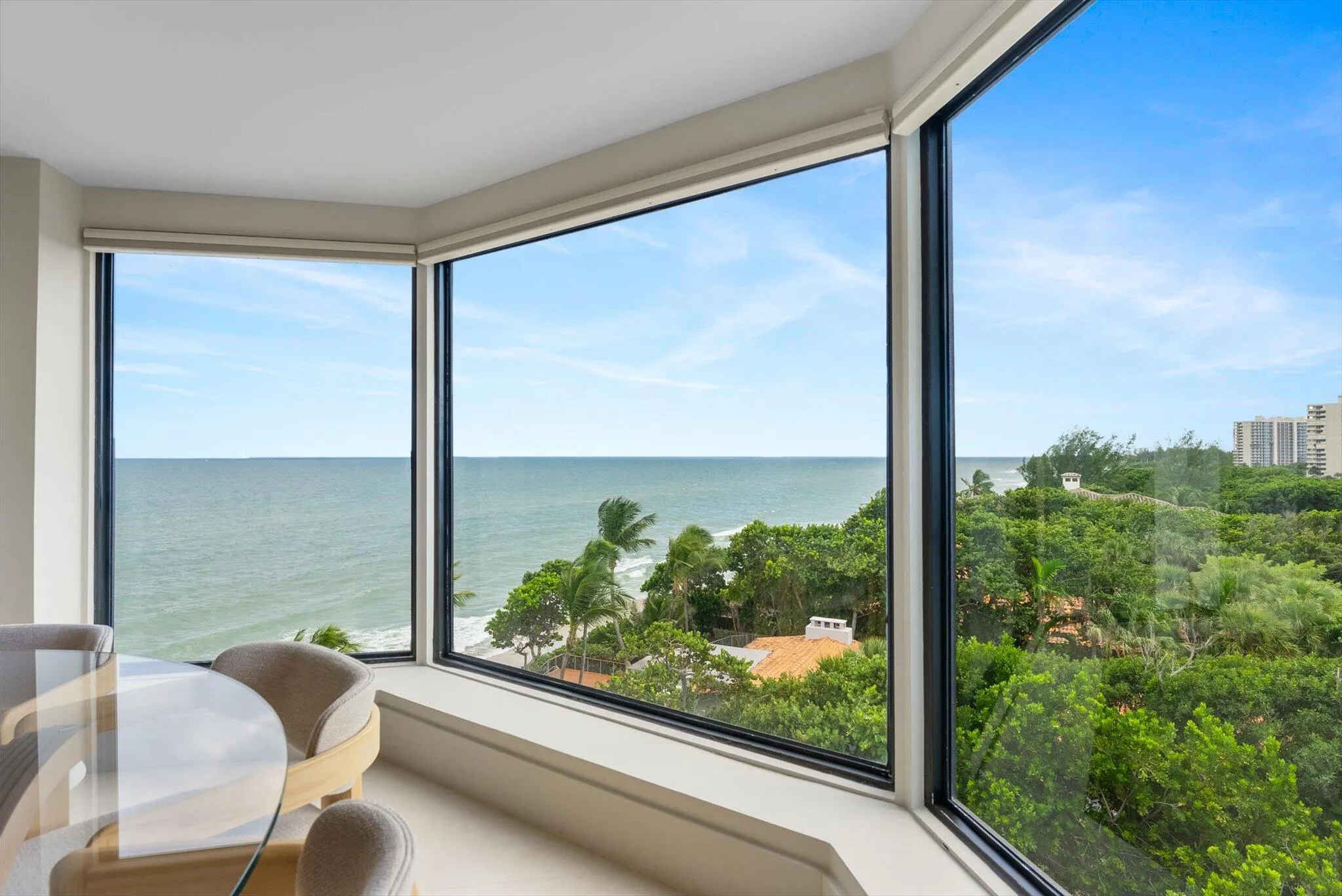 Architectural Dining Space framed by Expansive Glass
