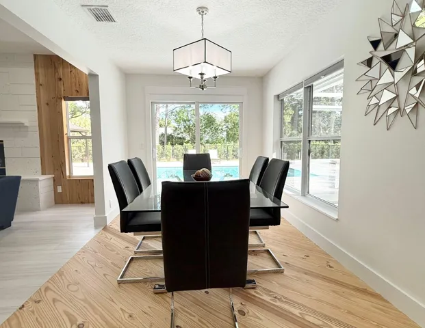 Dining area with finished wood flooring