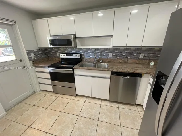 Kitchen with New Stainless Steel Appliances and Recessed Ceiling Lights