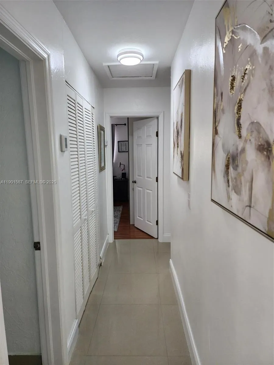 Hall from living room to Primary Bedroom