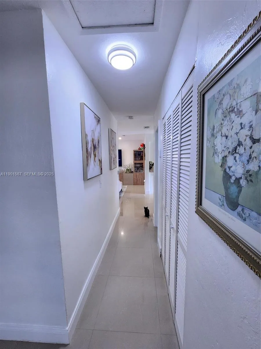Hall from bedrooms to living room /kitchen