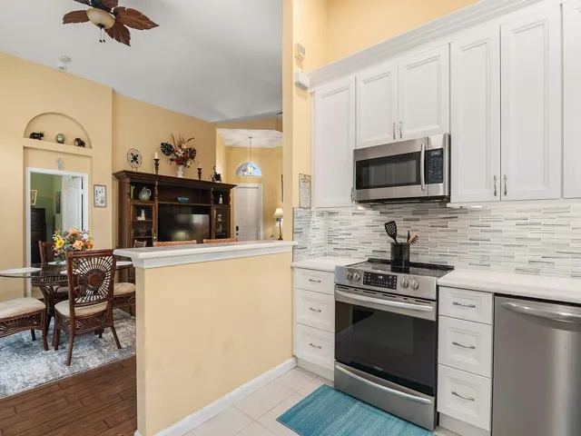 Kitchen open to dining and living room.
