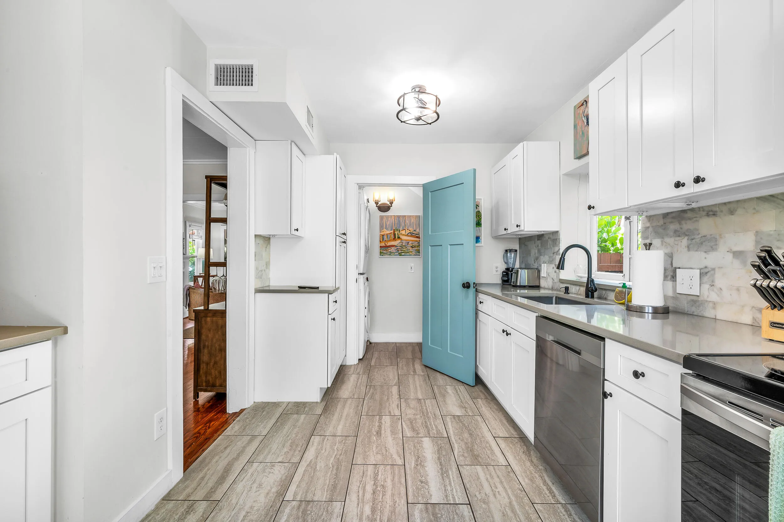 Kitchen with half bath and laundry.