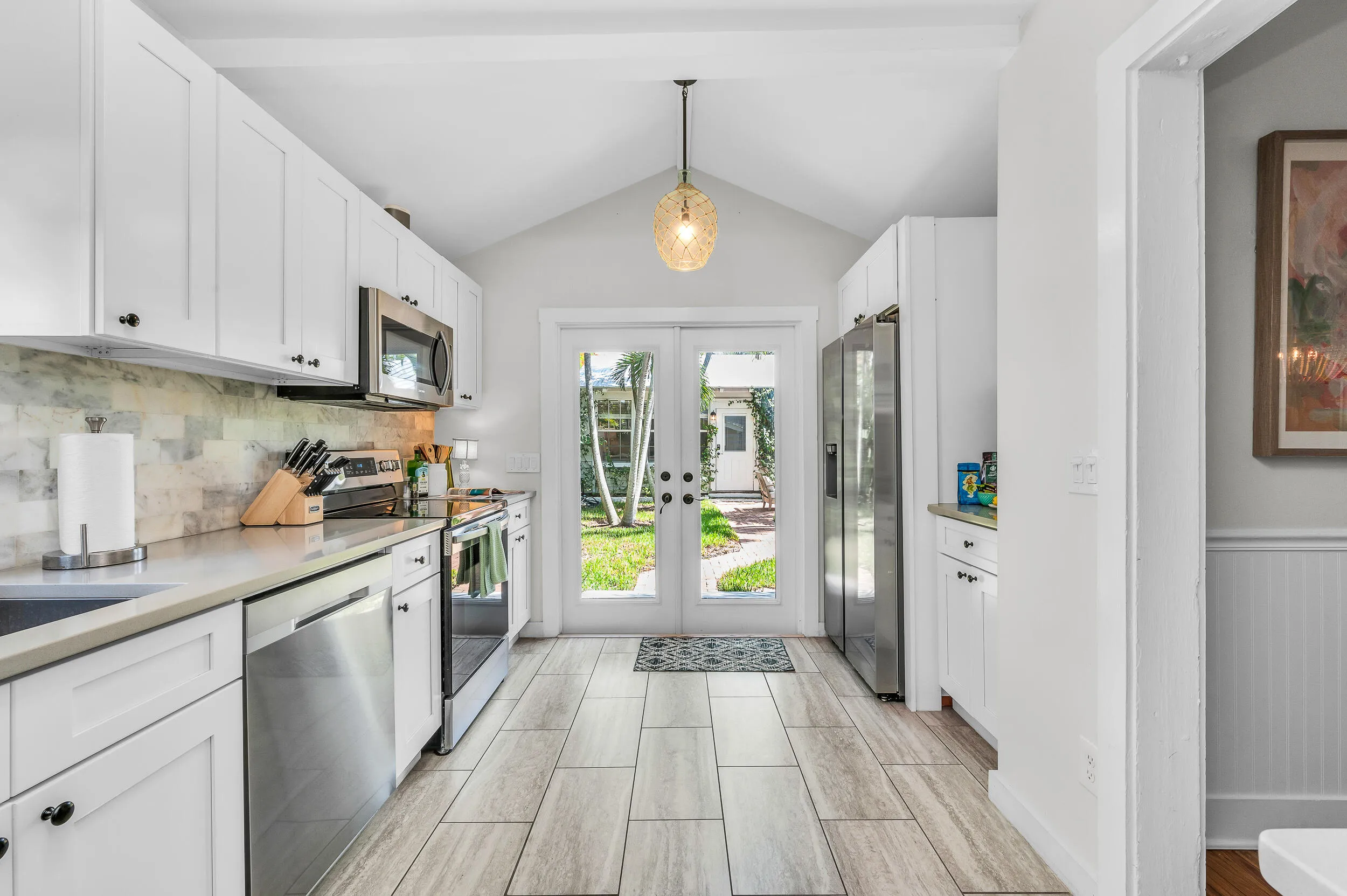 Kitchen with view to pool and garden