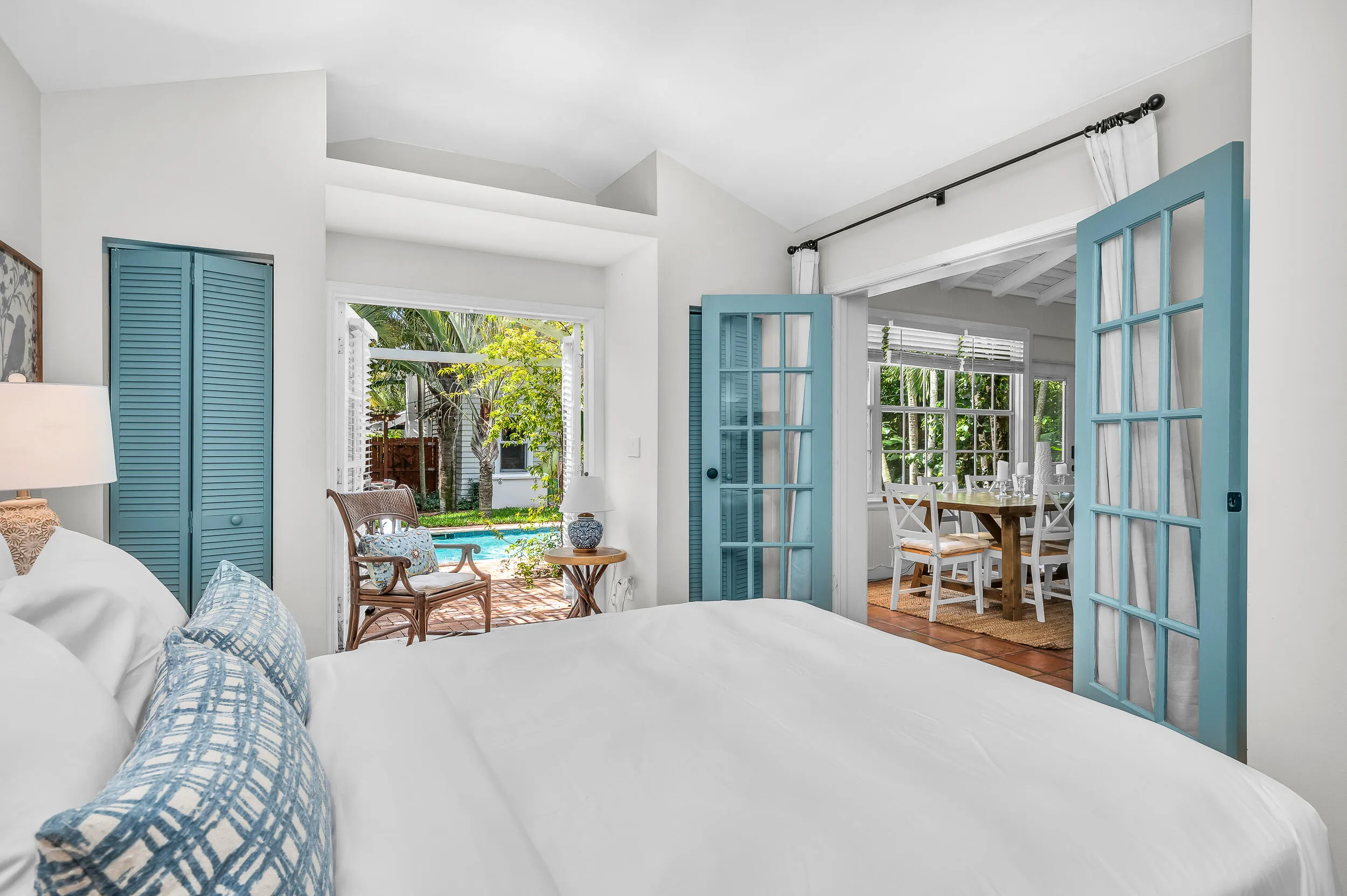 Guest House bedroom 1 with french doors and small sitting area