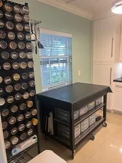 Kitchen Chef's table and supply shelves