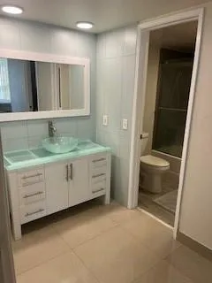 Primary Bedroom Vanity with entrance to bathroom