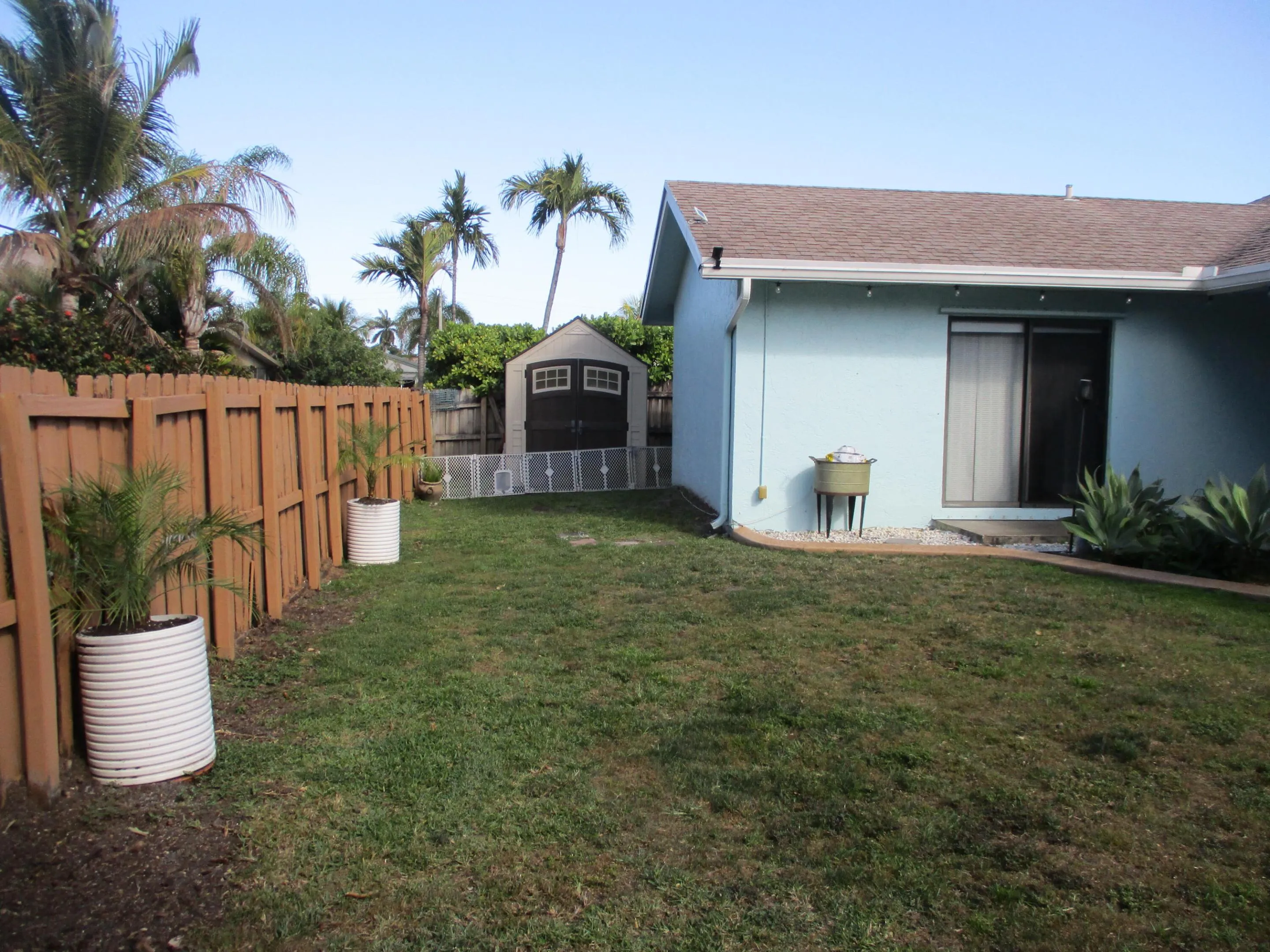 6x9 shed tucked away holding hurricane panels