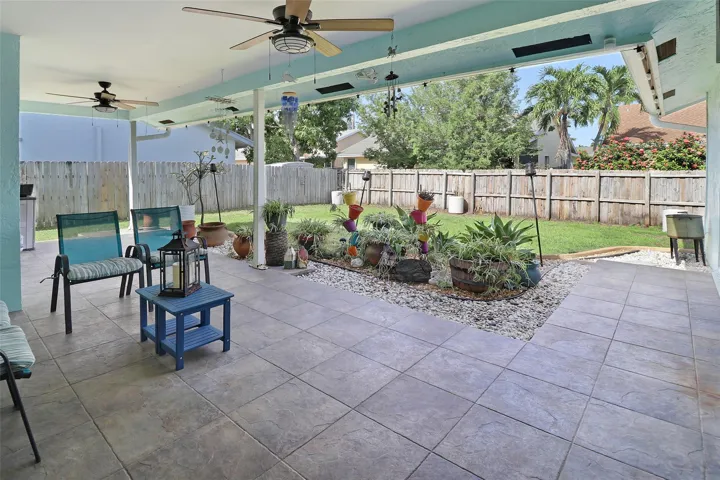 two fans circulating tropical air as you are seated for your BBQ, watching the kids play, maybe watching the dogs play or simply adding a swimming pool