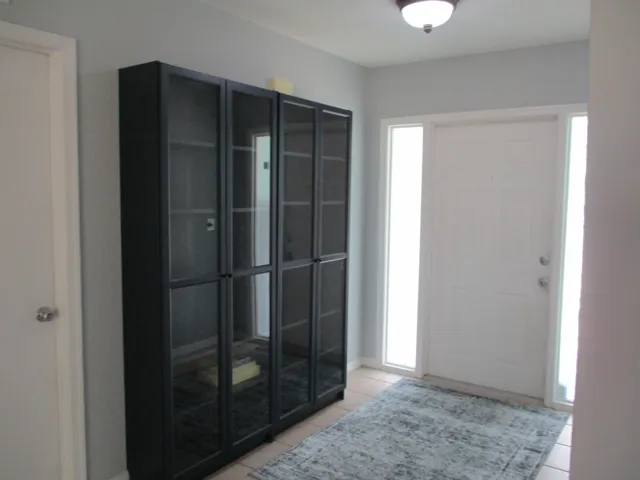 foyer entrance with a closet