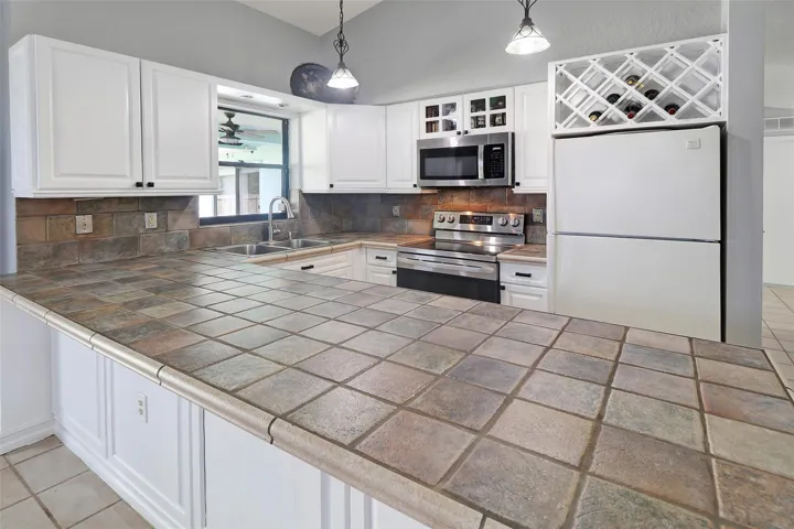 island for prepping food or adding chairs to feed your guests