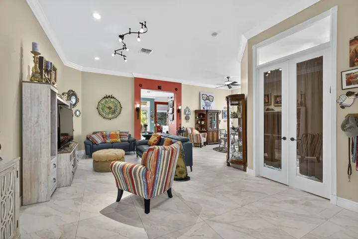 Great room with view of double door den entry