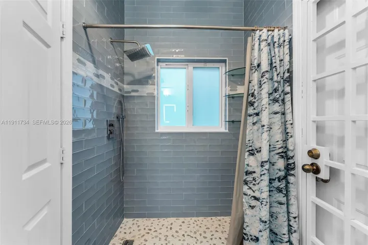 En-Suite Bathroom, with separate door exiting to terrace.