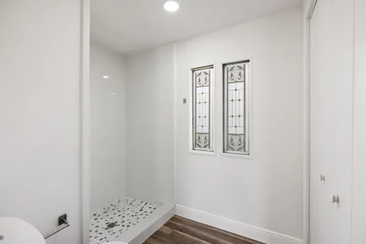 Full bath featuring recessed lighting and a walk in shower