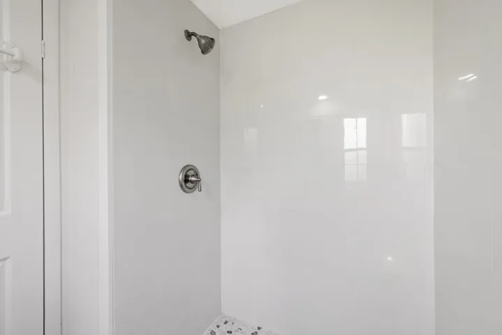 Bathroom featuring tiled shower
