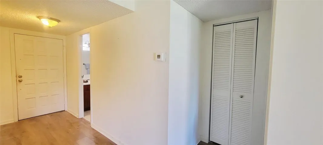 Foyer area including hall closet