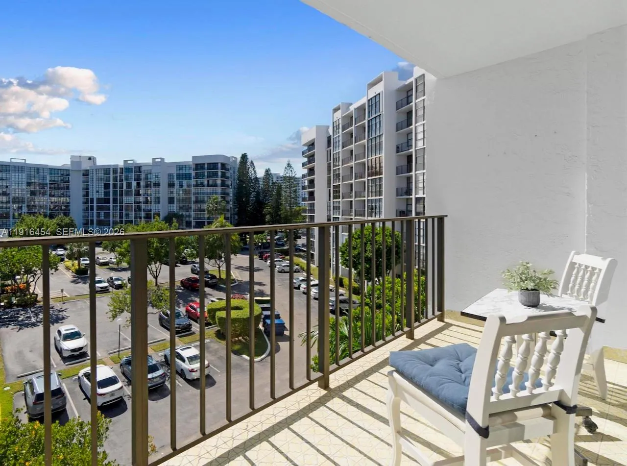 Clean and inviting balcony, to the south-west overlooking Oceanview Park Condominium. - Oceanview Park Condominium, Three Islands, Hallandale Beach, FL 33009. 1000 Parkview Drive, Unit #518.