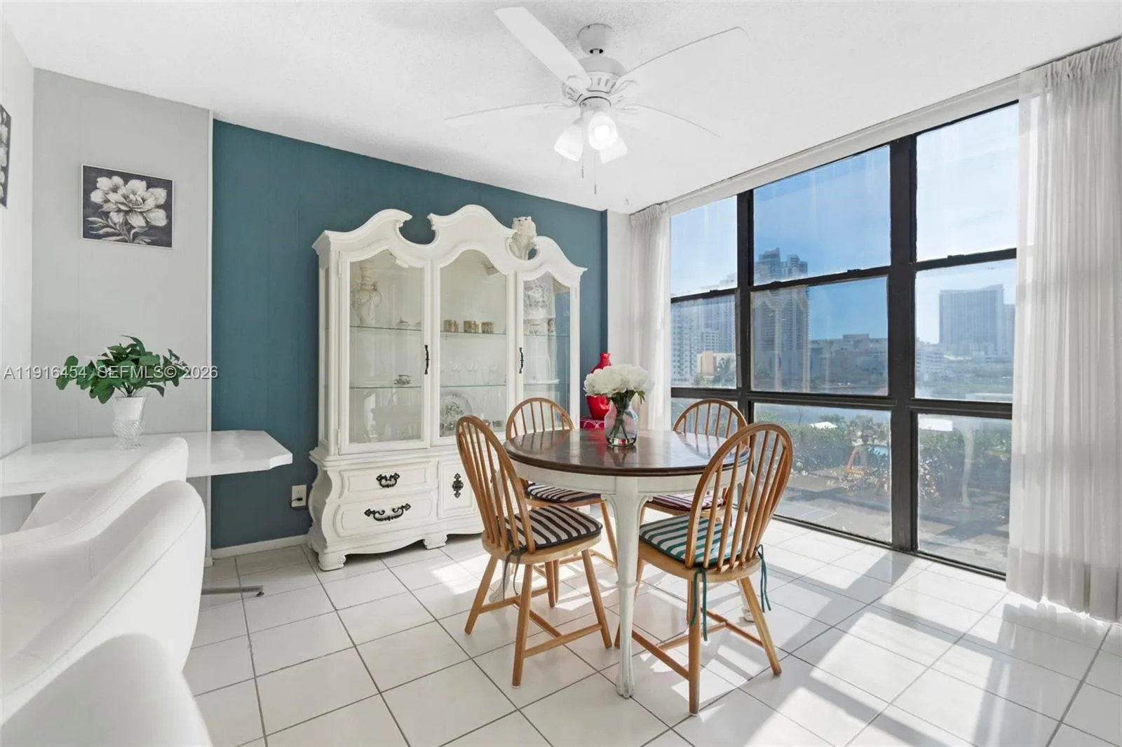 Dining corner with panorama windows. Kitchen counter with high chairs. - Oceanview Park Condominium, Three Islands, Hallandale Beach, FL 33009. 1000 Parkview Drive, Unit #518.