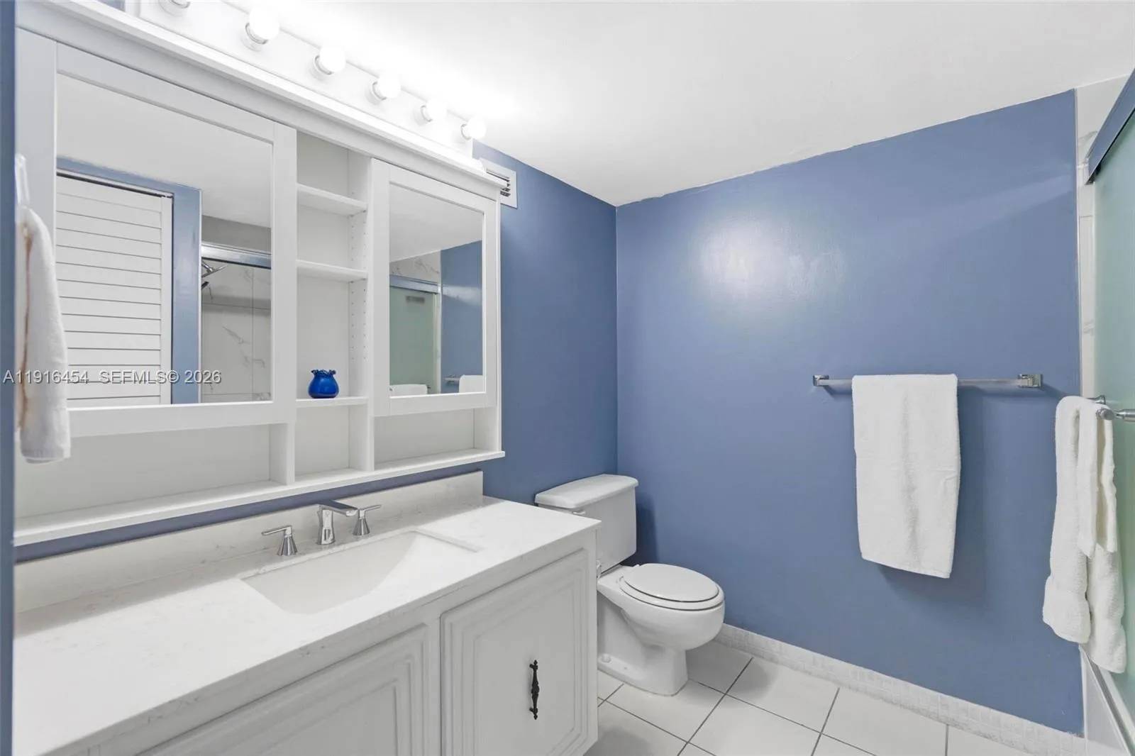 Updated main bathroom with shower/tub combination. - Oceanview Park Condominium, Three Islands, Hallandale Beach, FL 33009. 1000 Parkview Drive, Unit #518.