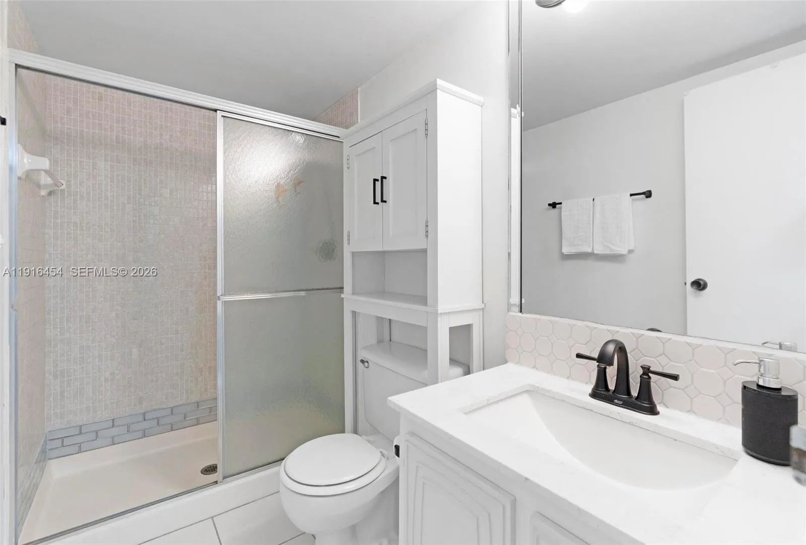 Full second bathroom with large walk-in shower. - Oceanview Park Condominium, Three Islands, Hallandale Beach, FL 33009. 1000 Parkview Drive, Unit #518.