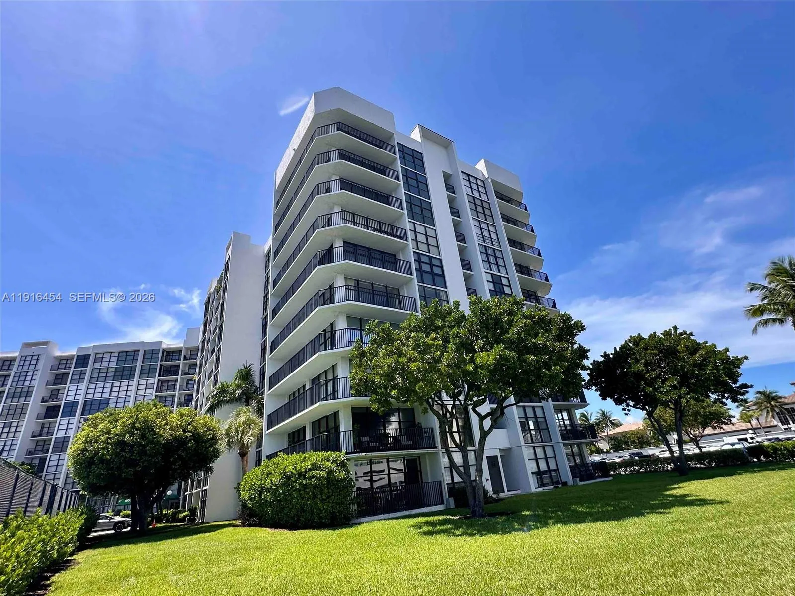 Oceanview Park Condominium is located waterfront in a lush green setting within the gated Three Islands area. - Hallandale Beach, FL 33009. 1000 Parkview Drive, Unit #518. For Sale.