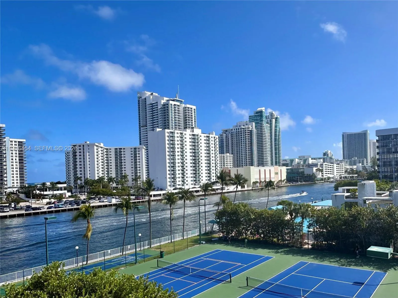 View from your balcony, overlooking the tennis courts, pool area and the Intracoastal Waterway. - Oceanview Park Condominium, Three Islands, Hallandale Beach, FL 33009. 1000 Parkview Drive, Unit #518.