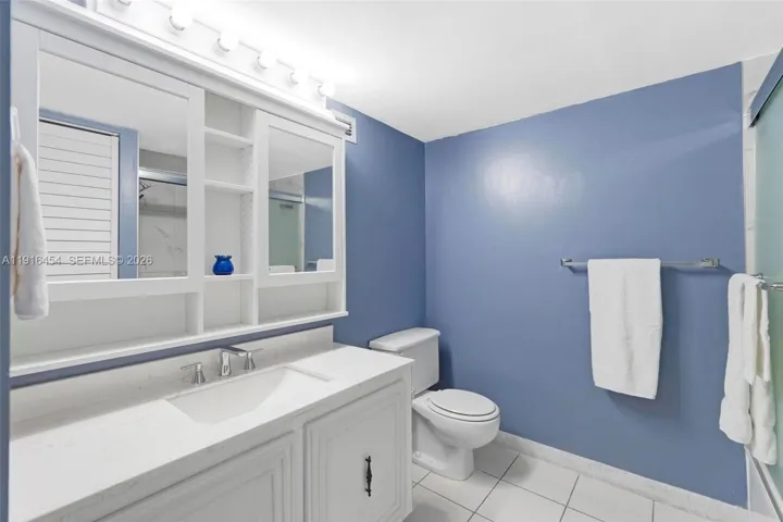 Updated main bathroom with shower/tub combination. - Oceanview Park Condominium, Three Islands, Hallandale Beach, FL 33009. 1000 Parkview Drive, Unit #518.