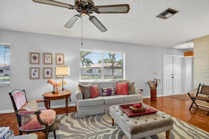 Tastefully decorated, wood floor, impact glass windows and hurricane main doors.