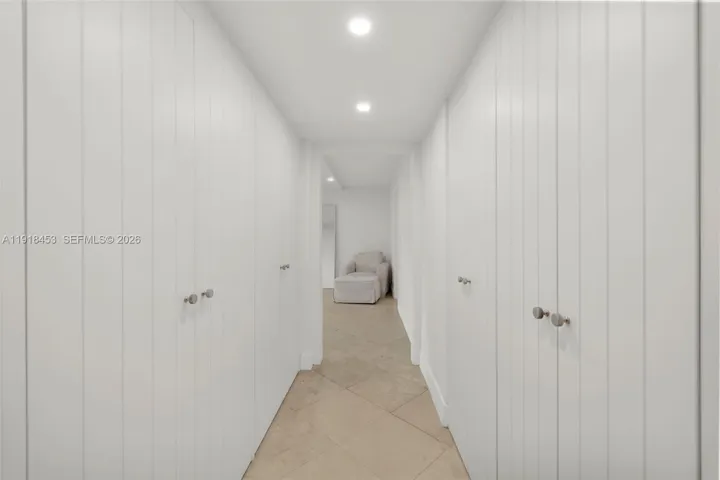 CLOSETS ON BOTH SIDES OF HALLWAY TO MASTER BEDROOM