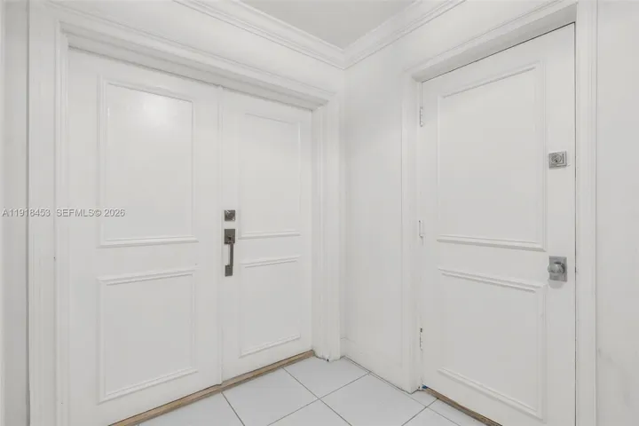 PRIVATE HALL, DOUBLE DOOR ENTRANCE PLUS SERVICE DOOR TO KITCHEN