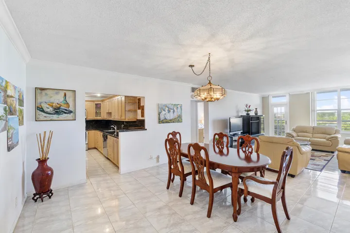 Grey tile throughout, open design to kitchen