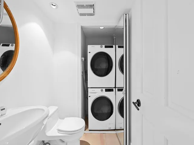 Laundry closeted in the powder room or 1/2 bath