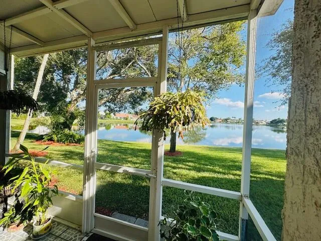 first floor waterfront screened in patio sliders from the living room as well as from the Kitchen area
